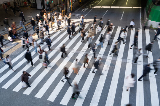 Crowded pedestrian crossing in motion from above