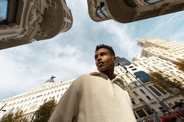 Fisheye. Modern portrait of man in Madrid city street 