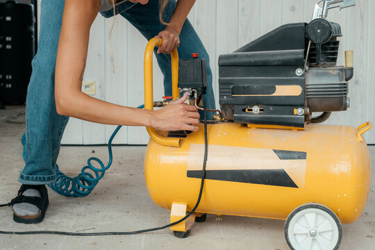 Skilled builder repairs equipment in a construction space