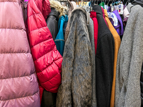 UGC messy rack of jackets in thrift shop