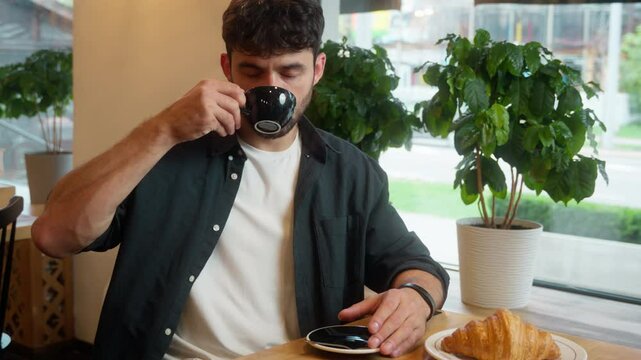 Caucasian man drinking coffee croissant male guy showing gesture ok cafe restaurant client visitor order lunch okay good approval recommend business businessman tasting breakfast indoor hand customer