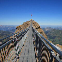 Suspension bridge connecting two peaks, Glacier 3000, Swiss Alps.