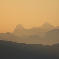 Outlines of mountain ranges in the golden morning hour, Bernese Oberland.