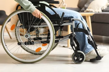 Fotobehang Woman in wheelchair at home © Pixel-Shot