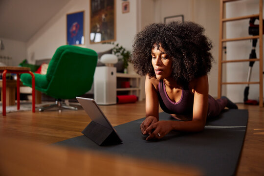Woman working out using a tutorial
