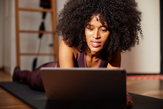 Woman working out with tutorial