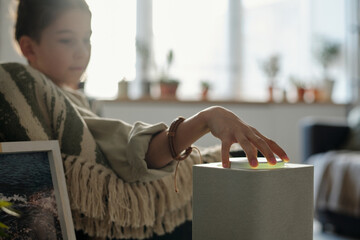 Kid Listening to Music with Smart Speaker at Home