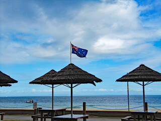 Flags flying on Moreton Island beach, Brisbane, Queensland, Australia