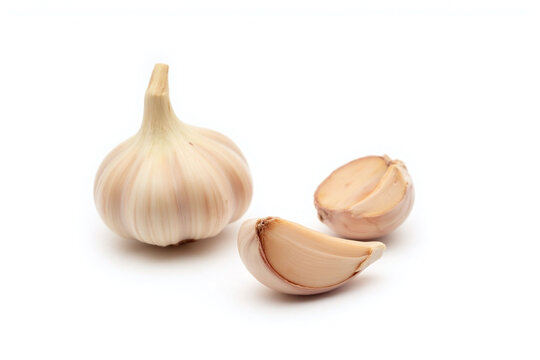 garlic bulb and half of it on white background