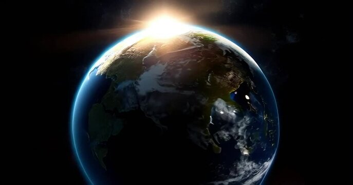 The sun appears from behind the earth in space