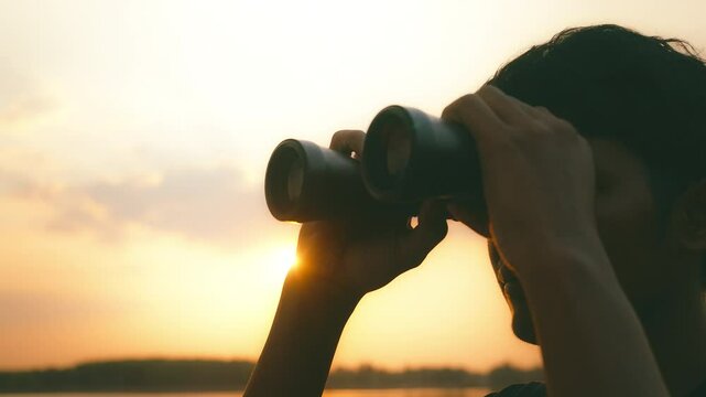 man use the binoculars.Concept perspective for future planning vision for success ideas.
