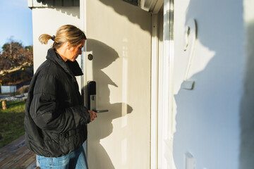 Woman Using Smart Lock to Open Door