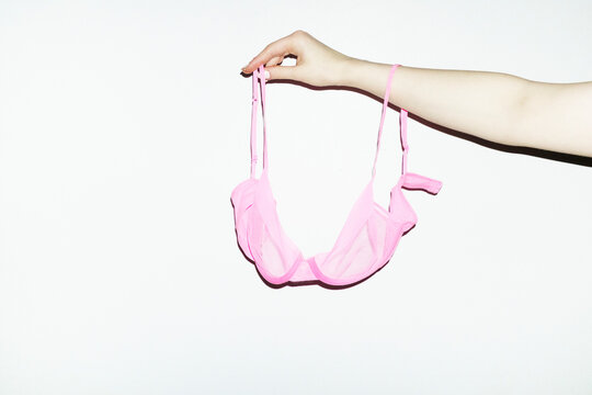 Hand & hot pink mesh lingerie underwear bra and hard direct flash