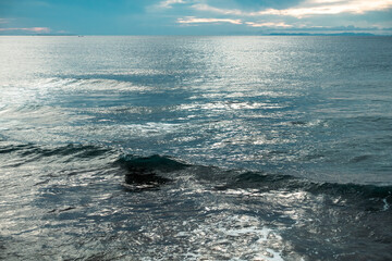 Dark sea and waves with cloudy background