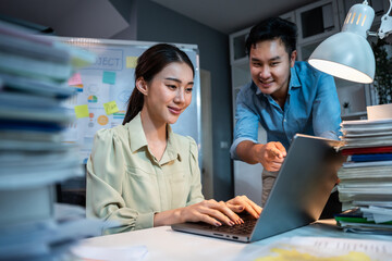Asian broker trader advise about investment stock market and graph in office. 