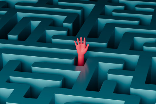 Hand reaching out for help in a complex maze structure