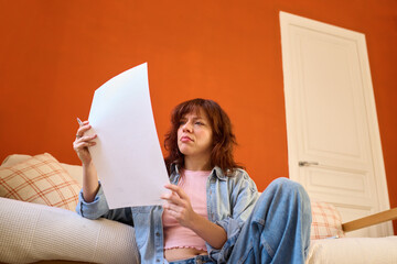 Serious and thoughtful reviewing a work document