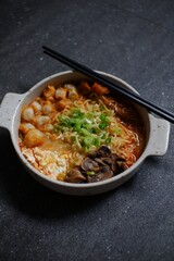 A bowl of spicy noodles soup 