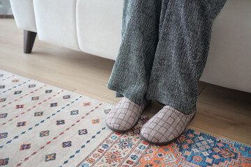 Cozy indoor setup with relaxed feet on a soft rug