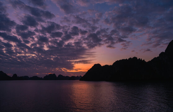 Purple and orange sunset in Halong bay, Vietnam.