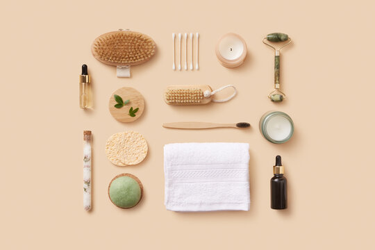 Arrangement of natural skincare and wellness products in beige studio