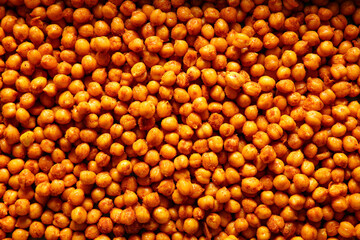 Texture of tasty fried chickpeas as background