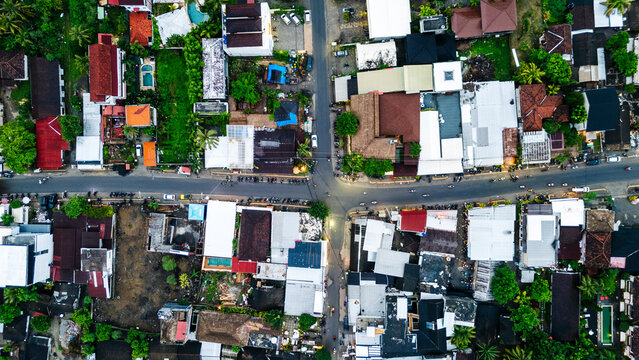 Aerial view of intersecting roads and dense residential buildings