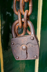 Rusty Padlock On Old Fence