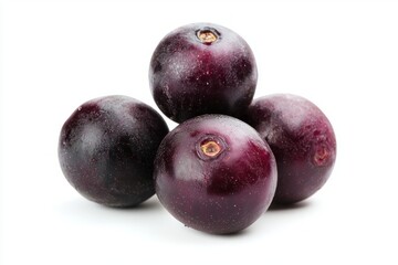 Obraz premium Close up of fresh ripe jabuticaba fruits showcasing vibrant purple color and organic freshness on white backdrop