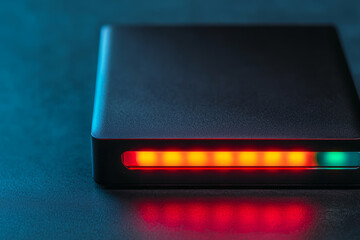 External hard drive performing automated backup with status LED glowing
