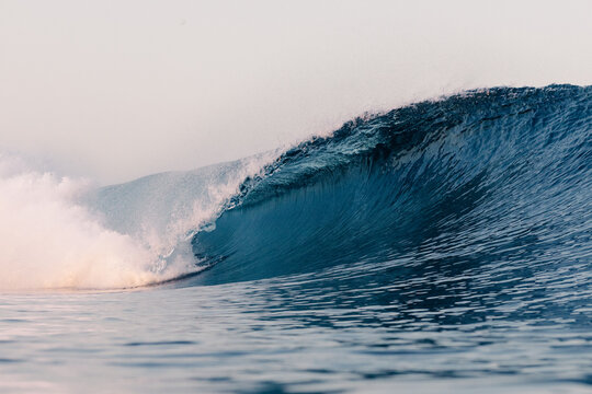 Perfect wave breaking against the ocean forming a tube