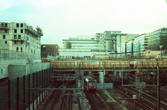 Train crossing under construction site in urban area