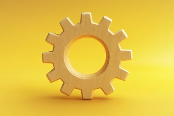 A wooden gear isolated against a vibrant yellow background