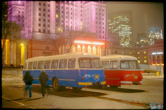 Retro buses in the city at night