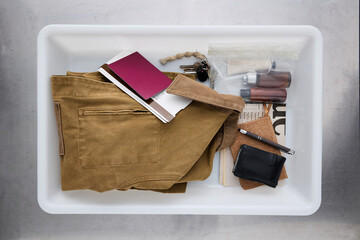 Personal Items in Security Tray at Airport Checkpoint Area