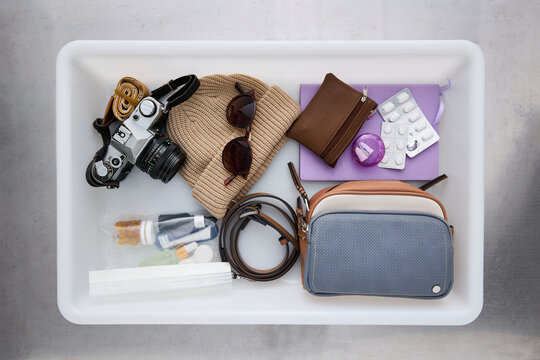 Assorted Travel Essentials in Airport Security checkpoint