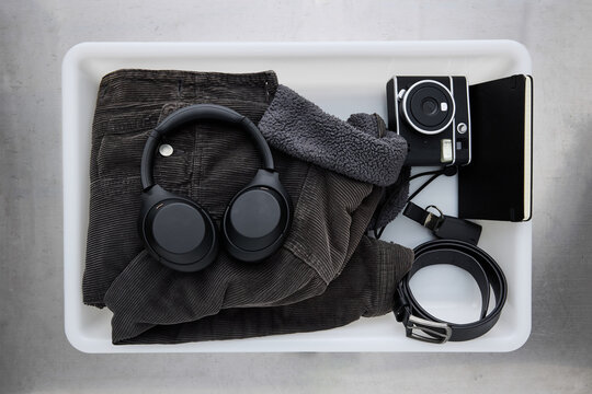 Airport check-in tray with personal items before traveling