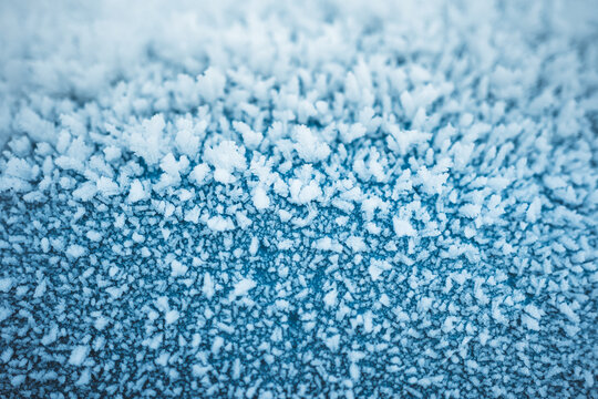 snow crystal on blue metal