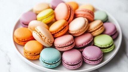Obraz premium A plate of colorful macarons in pastel shades, arranged neatly on a white marble surface.