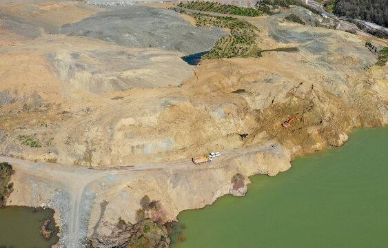 Loader leveling landfill in the field