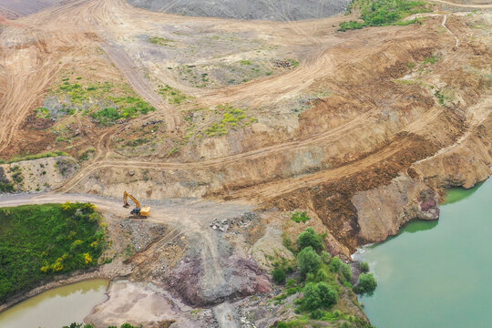 Loader leveling landfill in the field