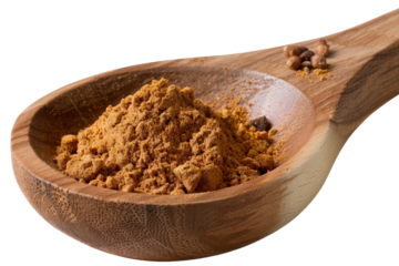 Ground spice powder in wooden spoon with scattered seeds, close-up view showcasing rich texture and earthy color tones