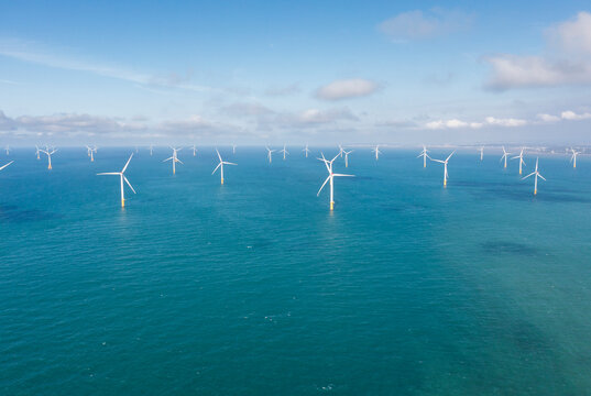 Panoramic Offshore Wind Farm in Turquoise Ocean Seascape View