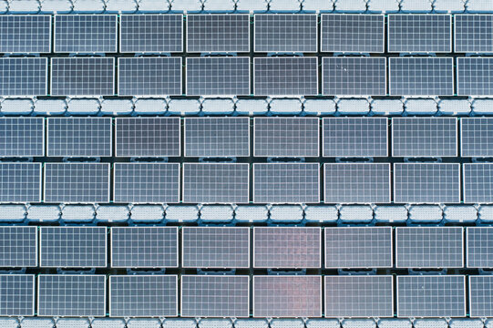Geometric Pattern of Floating Solar Panel Array Aerial Close Up