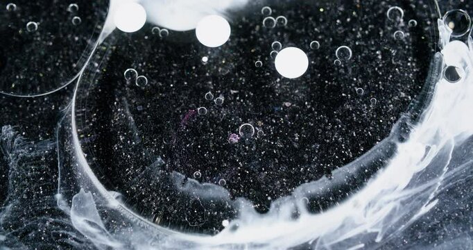 Water art. Droplet background. Blur white color chemical round liquid fluid transparent molecular oil glitter circling on abstraction.