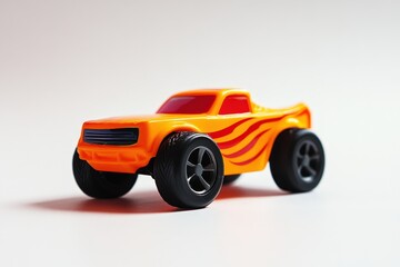 A bright orange toy truck with flame decals is pictured here
