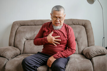 Fototapeta premium Elderly Male Suffering From Heart Attack And Feel Unwell Need For Medicine