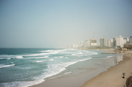 Waves Crashing Along the Shoreline of Tel Aviv's Beach. Film photo.