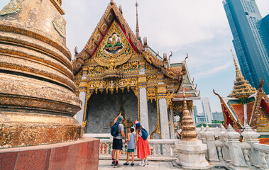 A family visits an old temple in Bangkok