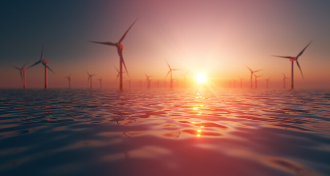Wind turbine Park at sea in sunset green energy